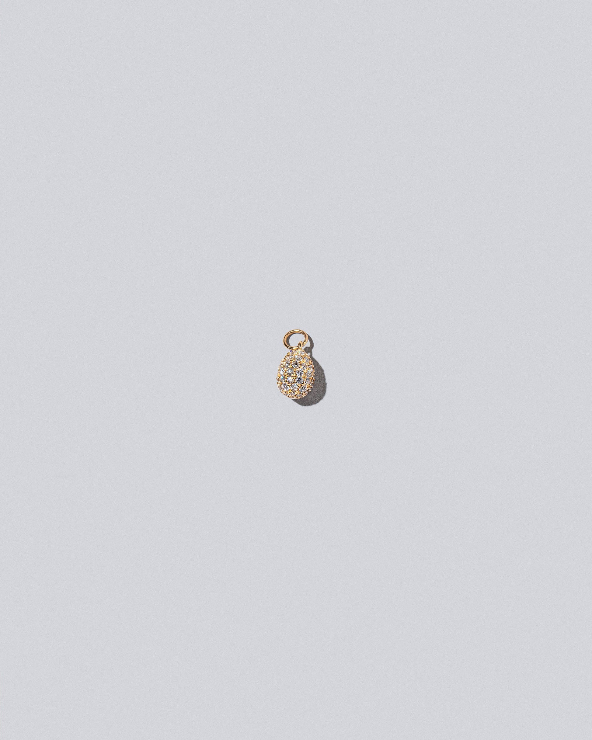 Pavé Blue Egg Charm on light colored background