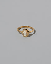 Moval Diamond Precise Ring on light color background.