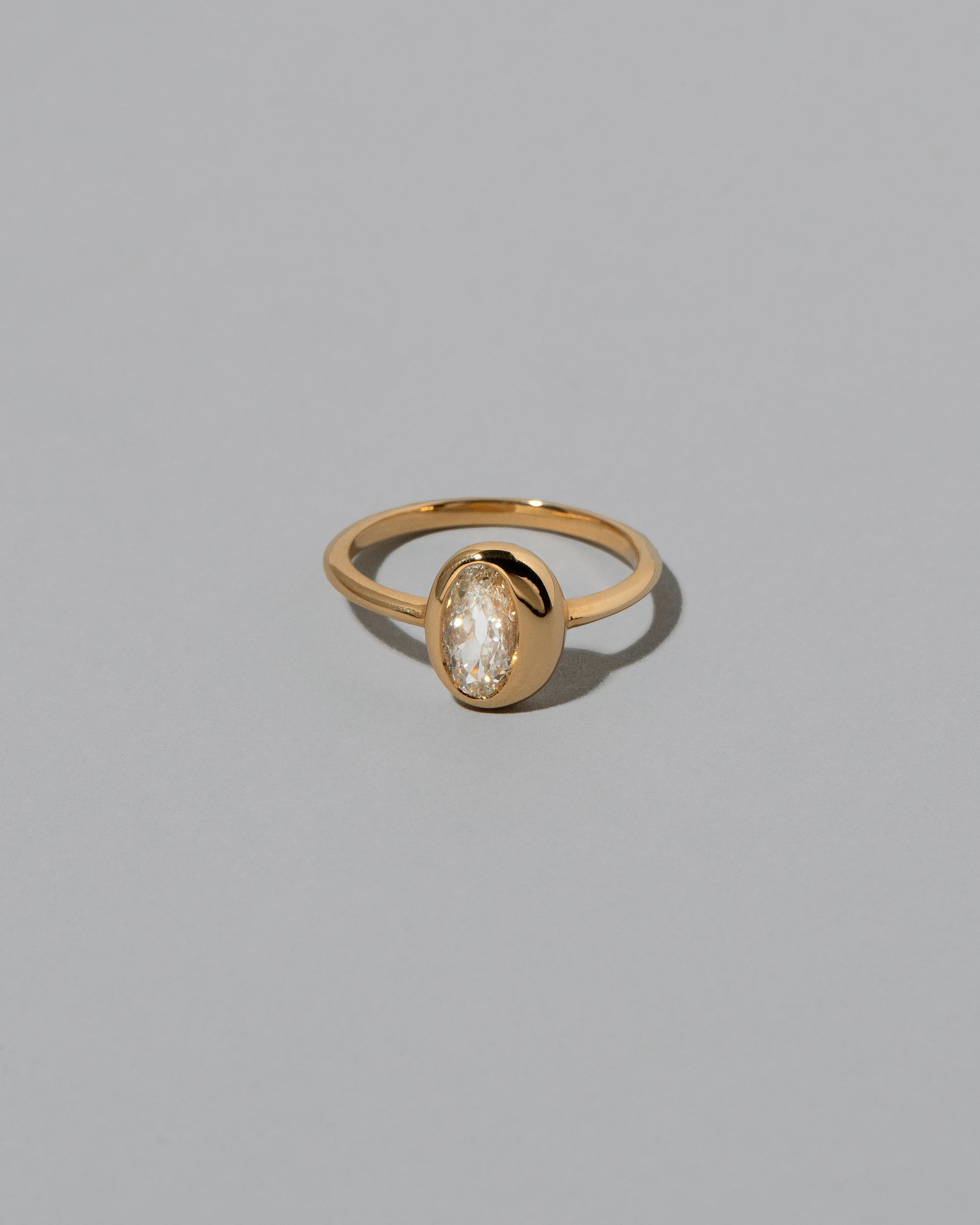 Moval Diamond Precise Ring on light color background.