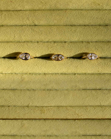 Closeup details of the custom jewelry displays within the Mociun Williamsburg Brooklyn Showroom interior, featuring autumnal colors, warm walnut finishes and  furnishings from Bower Studios.