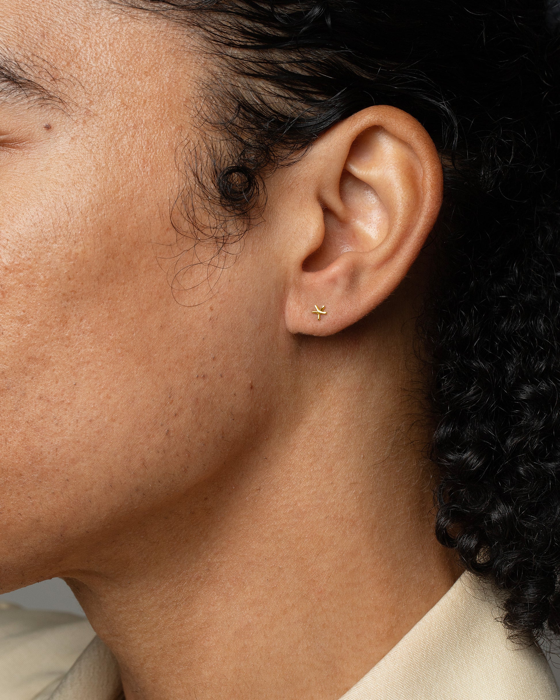 Star Stud Earring Single on male model.