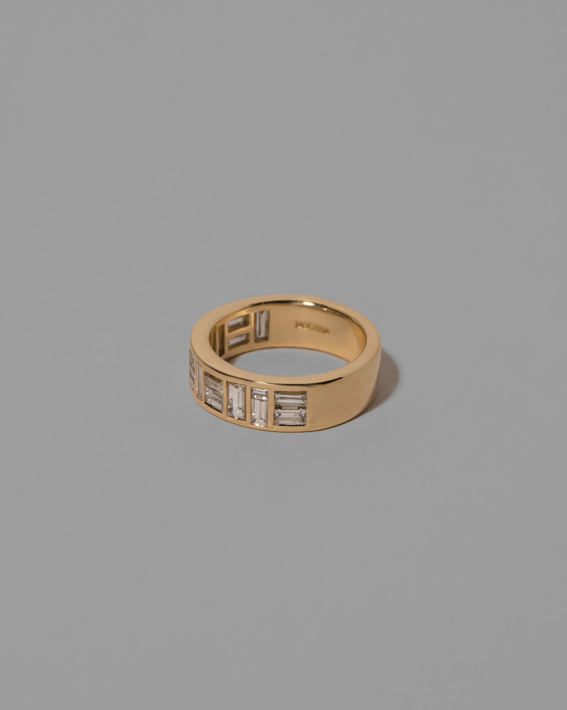 View from the side of the Mega Piet Ring on light color background.