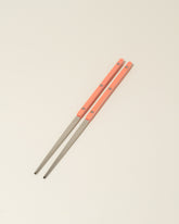 Sabre Paris Garden Green Chopsticks on light color background.