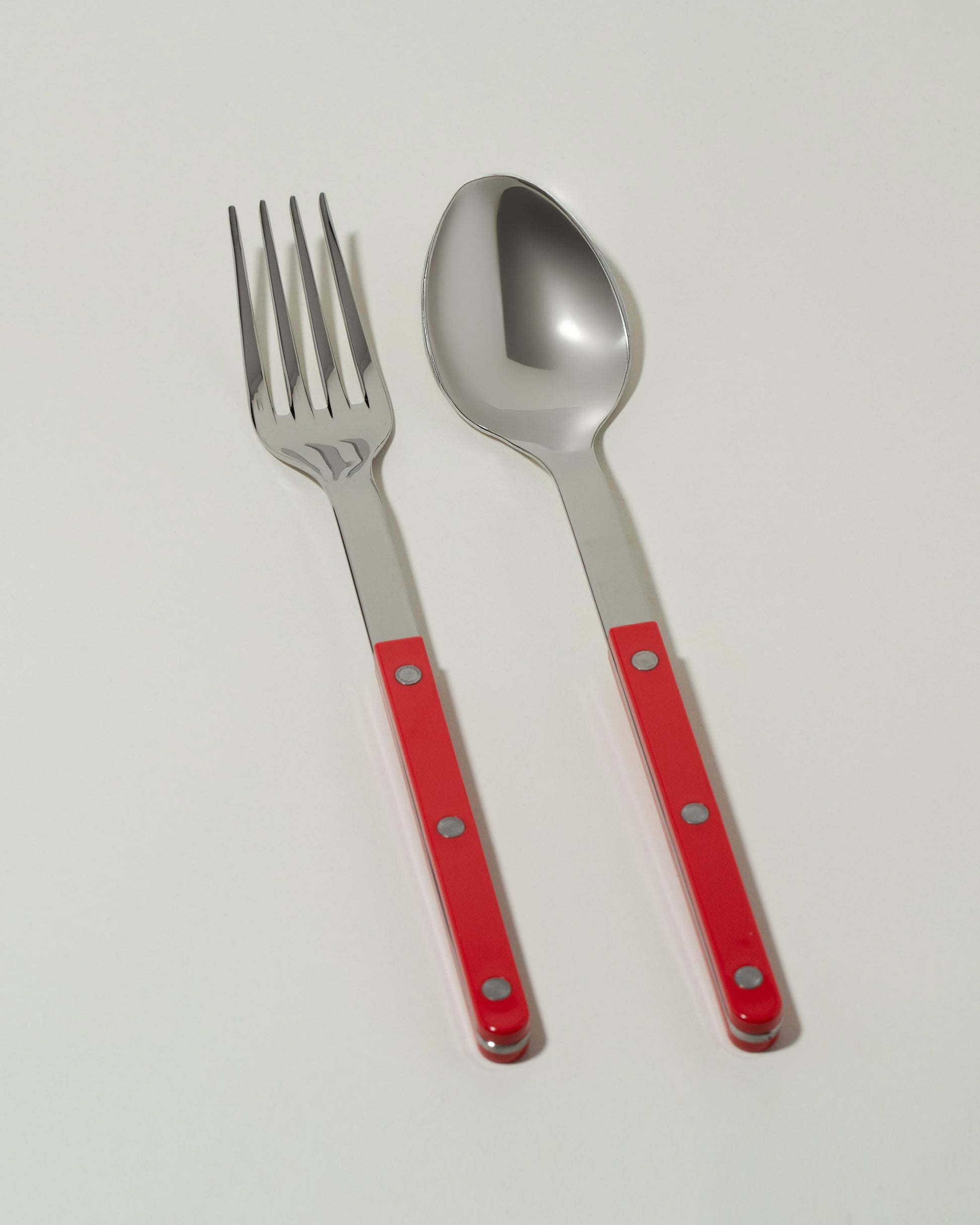 Sabre Paris Red Serving Set on light color background.