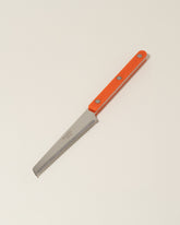 Sabre Paris Orange Tomato Knife on light color background.