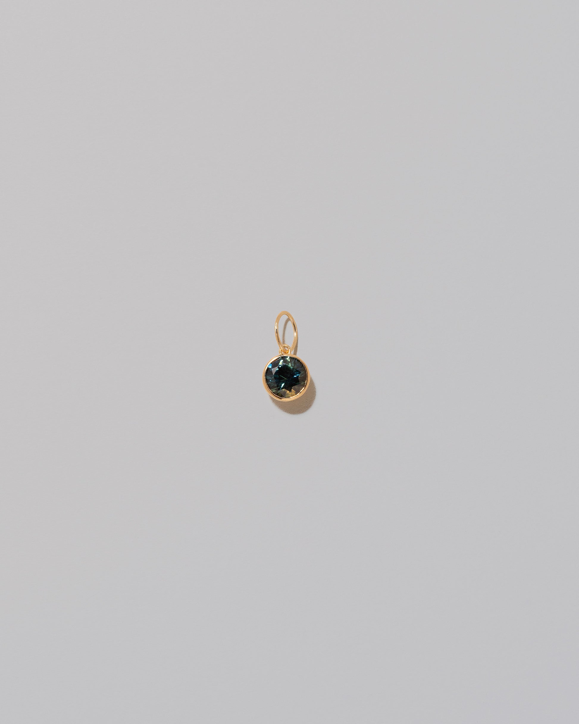 Bicolor Sapphire Pendant on light color background.