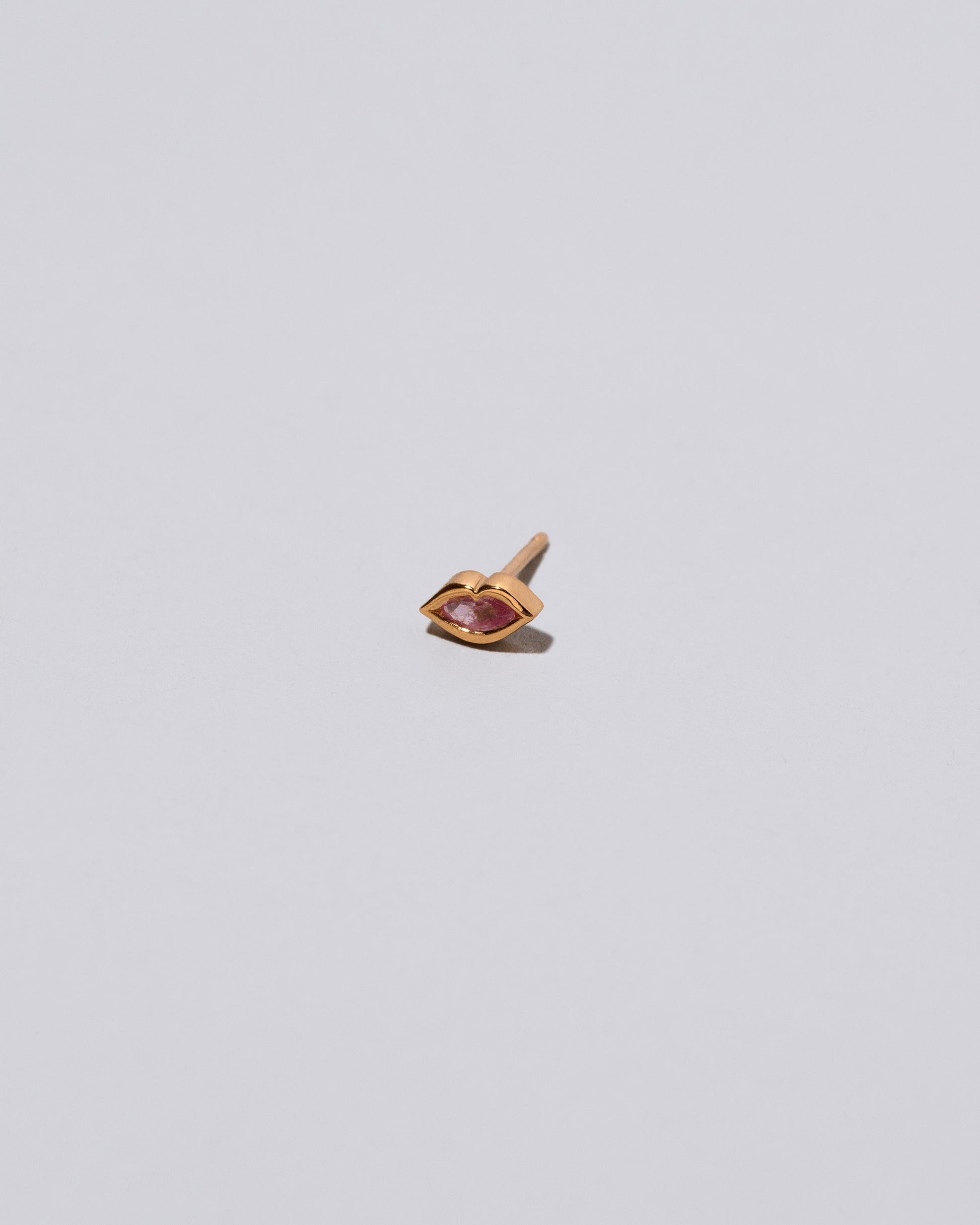 Light Pink Sweet Little Kiss Stud Earring Single on light color background.