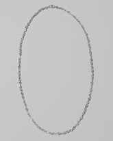 CRZM Sterling Silver Infinity Chain Necklace on light color background.