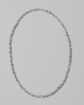 CRZM Sterling Silver Torsional Chain Necklace on light color background.