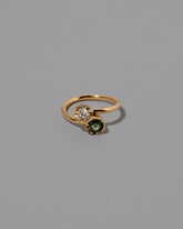 Sapphire & Champagne Diamond Sun & Moon Union Ring on light color background.