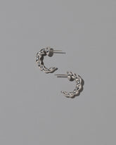CRZM Sterling Silver Foothill Hoop Earrings on light color background.