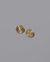 CRZM Gold Serpentinite Stud Earrings on light color background.