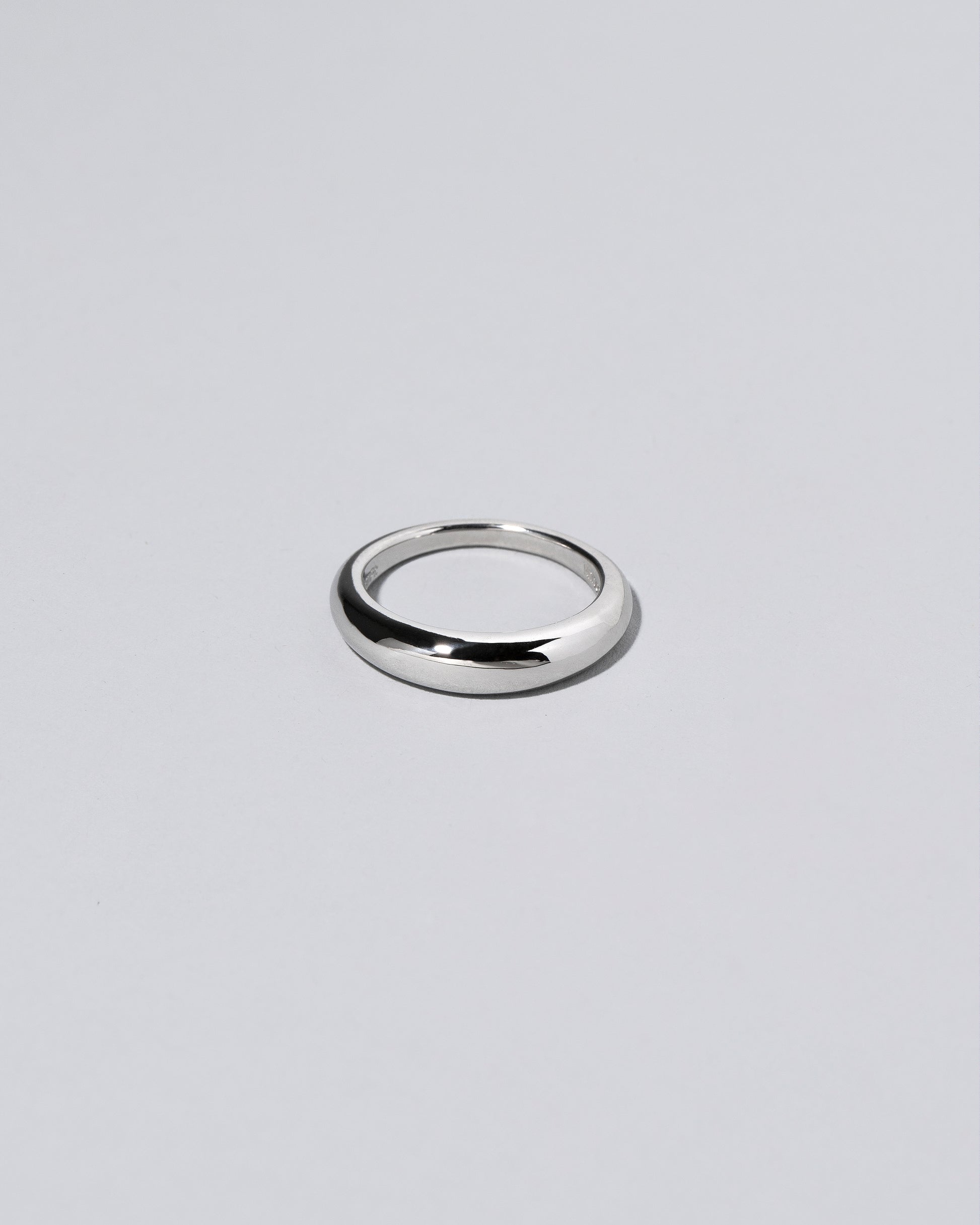 Platinum 4.5mm Venus Band on light color background.