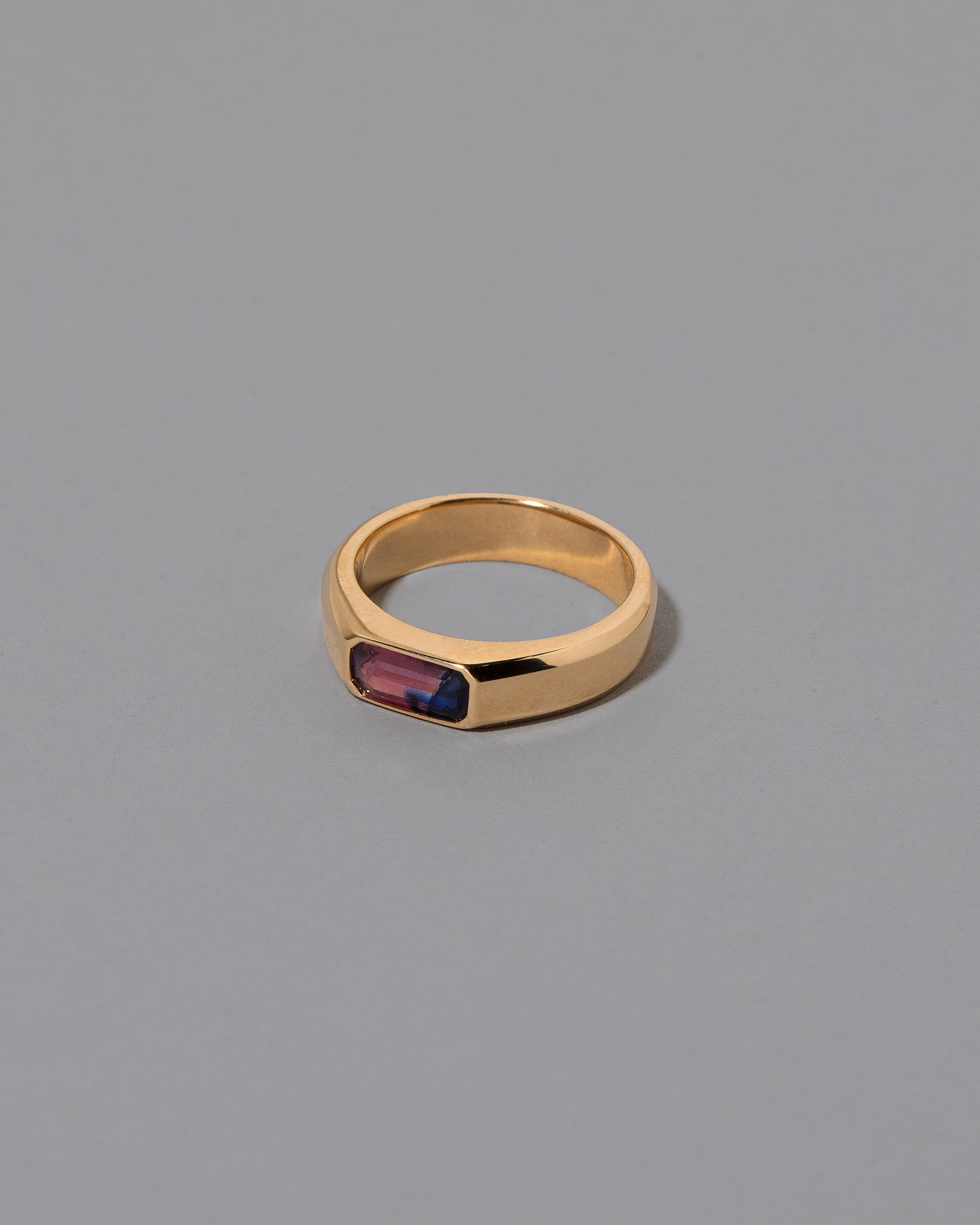 View from the side of the Wellspring Ring on light color background.