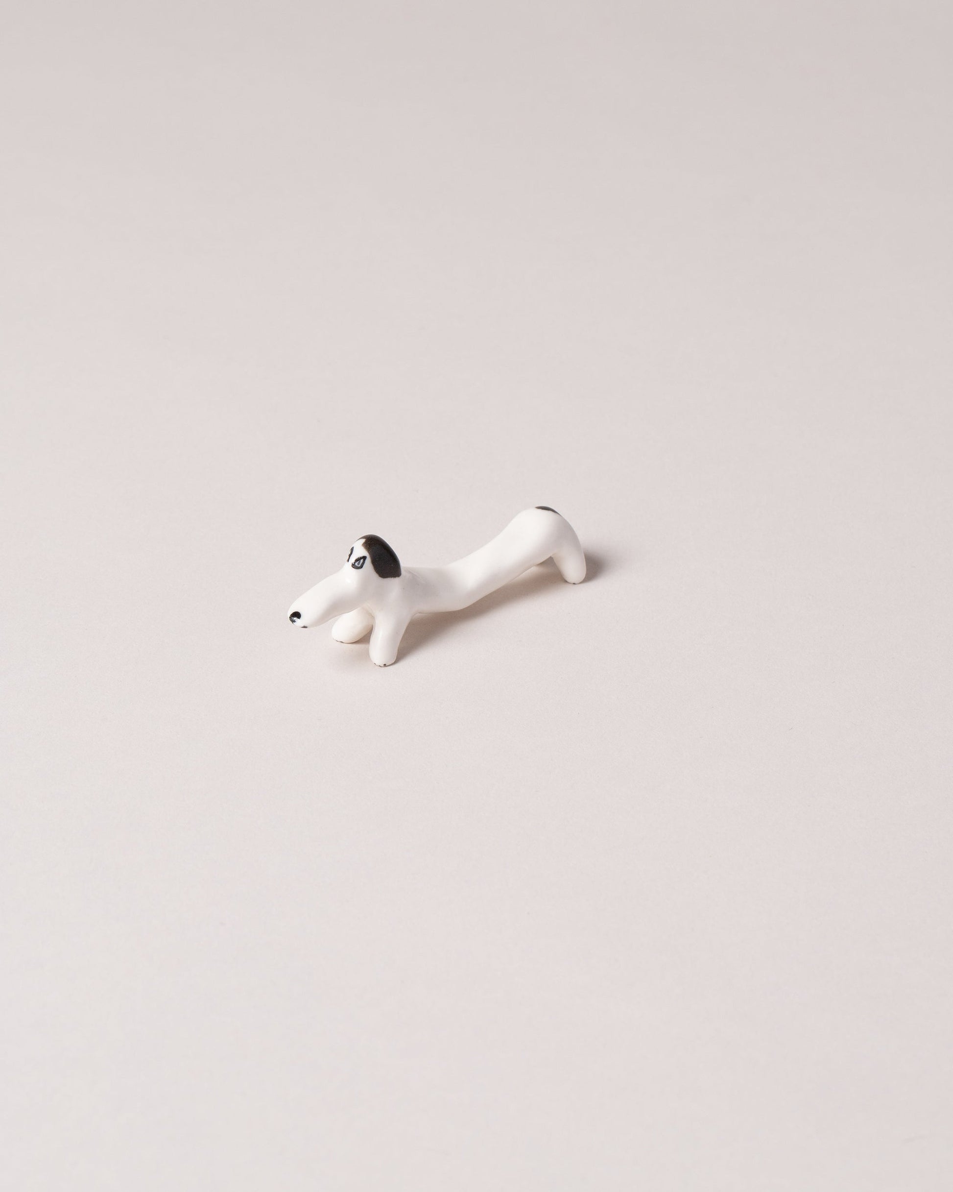 Eleonor Boström Black Chopstick Dog Rest on light color background.