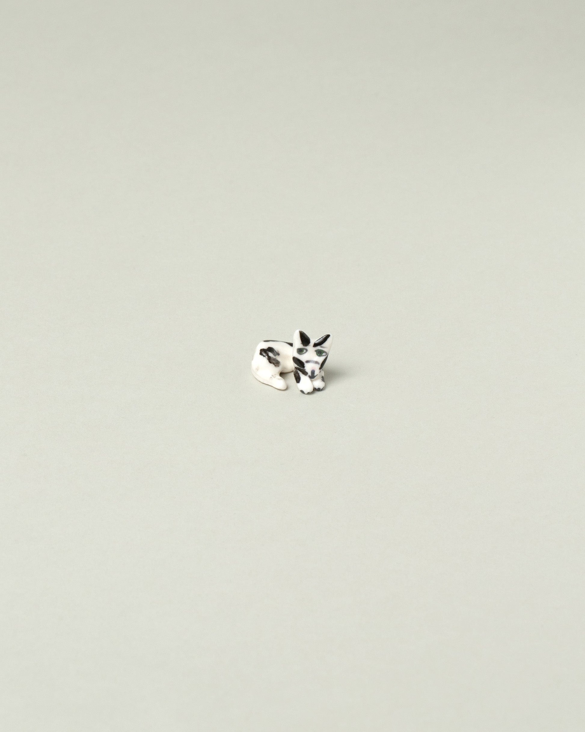 Eleonor Boström Black Spots Chopstick Cat Rest on light color background.