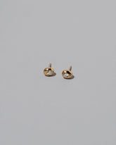 Diamond Birthstone Level Stud Earrings on light color background.