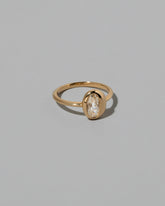 View from the side of the Moval Diamond Precise Ring on light color background.