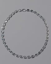 CRZM Sterling Silver Yuba Mini Necklace on light color background.