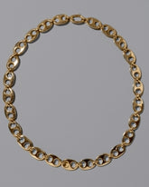CRZM Gold Yuba Medium Necklace on light color background.