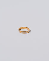 4mm Yellow 18K Outside and Platinum Inside Swimming Pool Band on light color background.