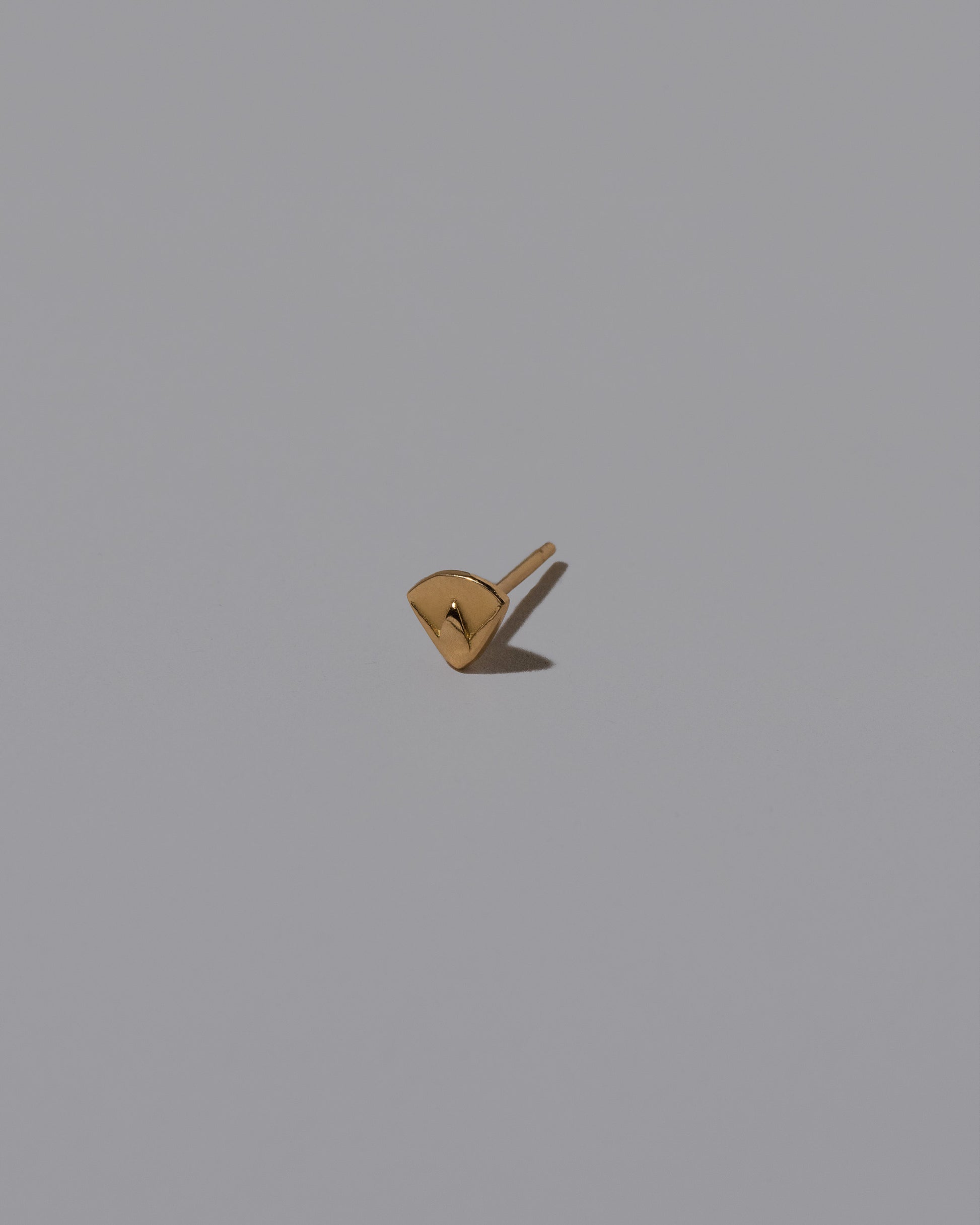 Lotus Blossom Stud Earring Single on light color background.