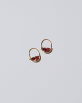 Bisous Hoop Earrings on light color background.