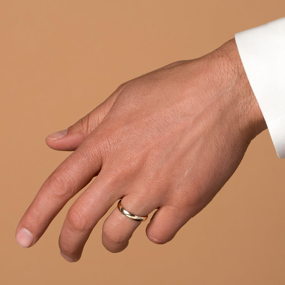 product_details::Gold 5mm Half Round Band on male model.