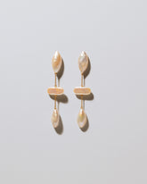 Osprey Pearl Earrings on light color background.
