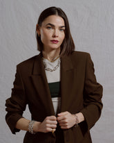 Styled image featuring CRZM jewelry on model.