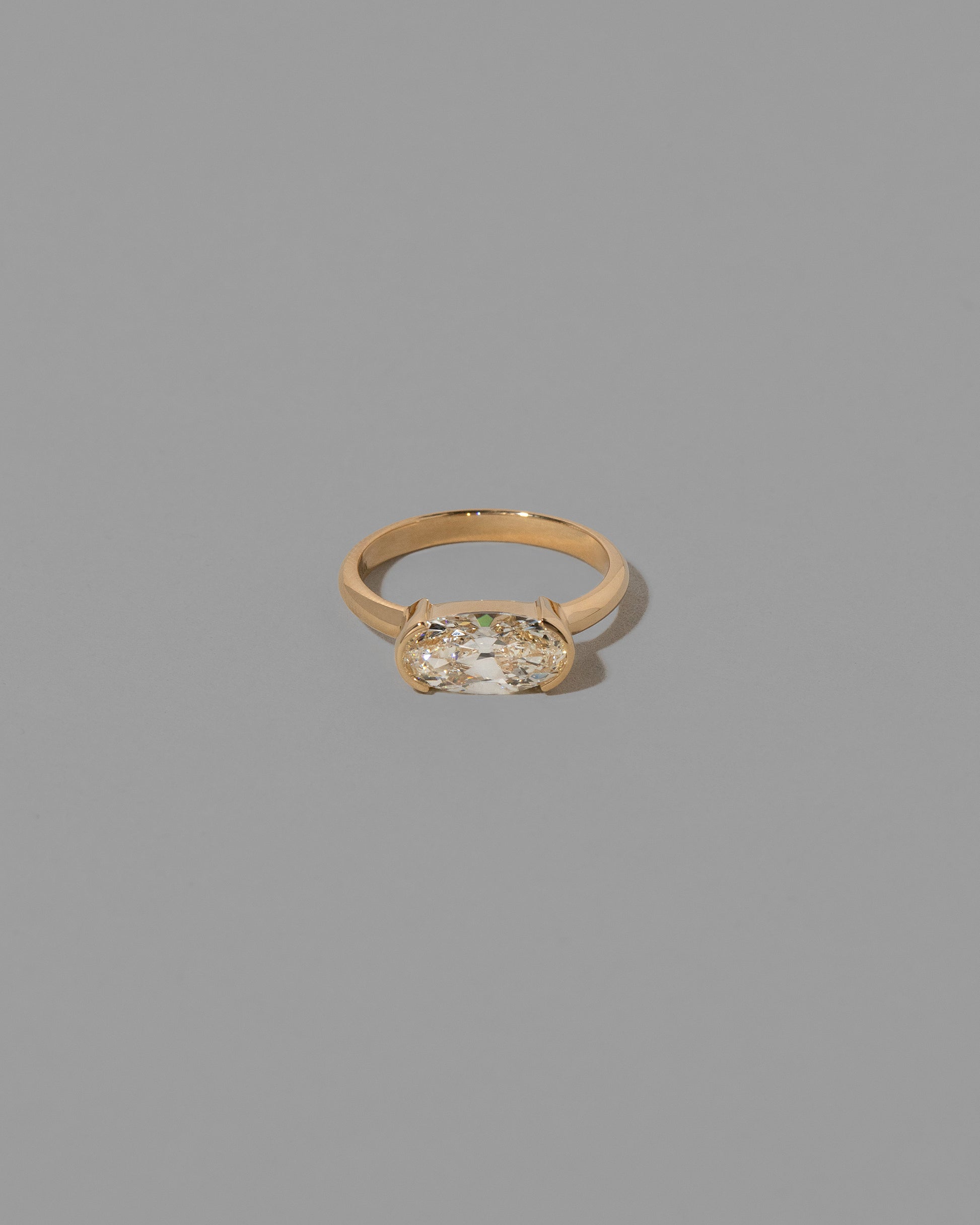 White Diamond Oval Diamond Transformation Ring on light color background.
