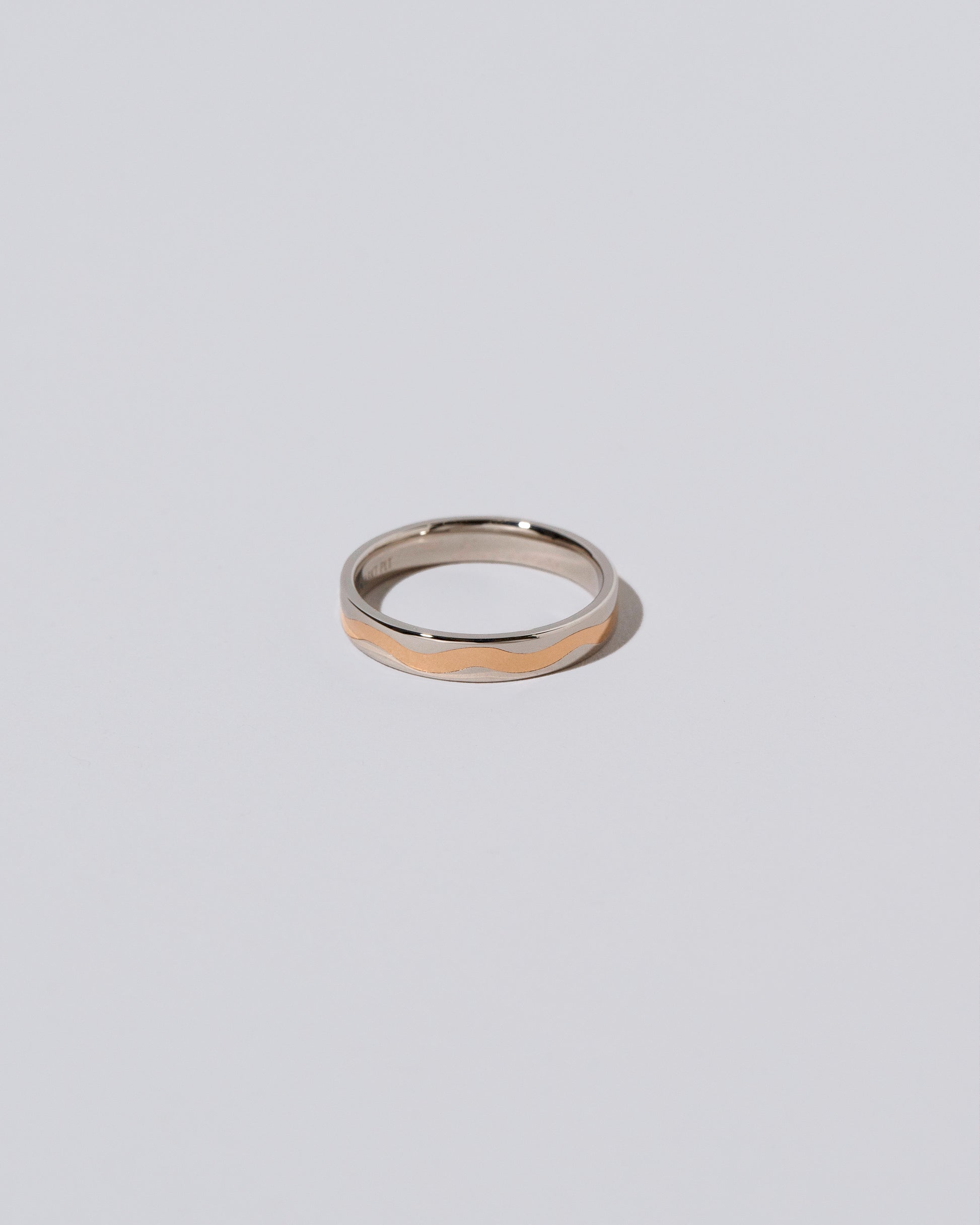 3mm Platinum Outside, Yellow 18K Inside Swimming Pool Band on light color background.