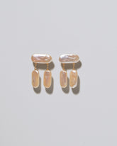Crake Pearl Earrings on light color background.