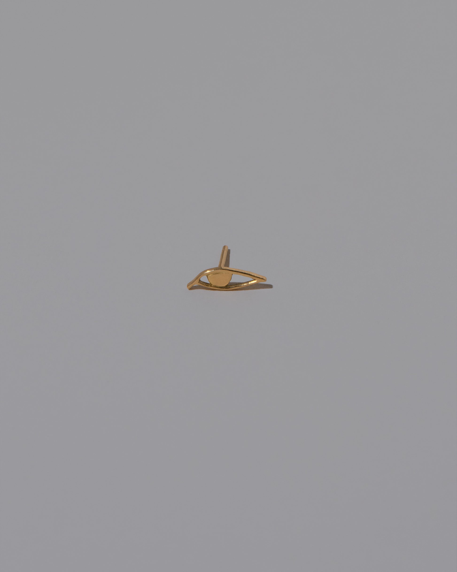 Left Eye Stud Earring Single on light color background.