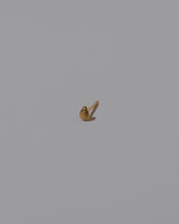 Tear Stud Earring Single on light color background.