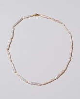Stick Pearl Strand Necklace on light color background.