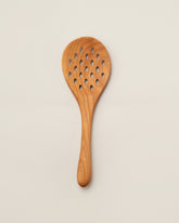 Jonathan's Spoons Skimmer Spoon on light color background.