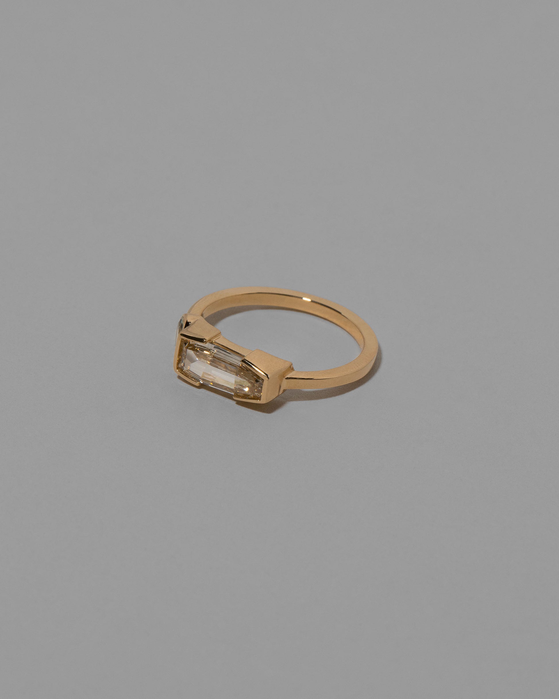 View from the side of the Cherish Ring on light color background.