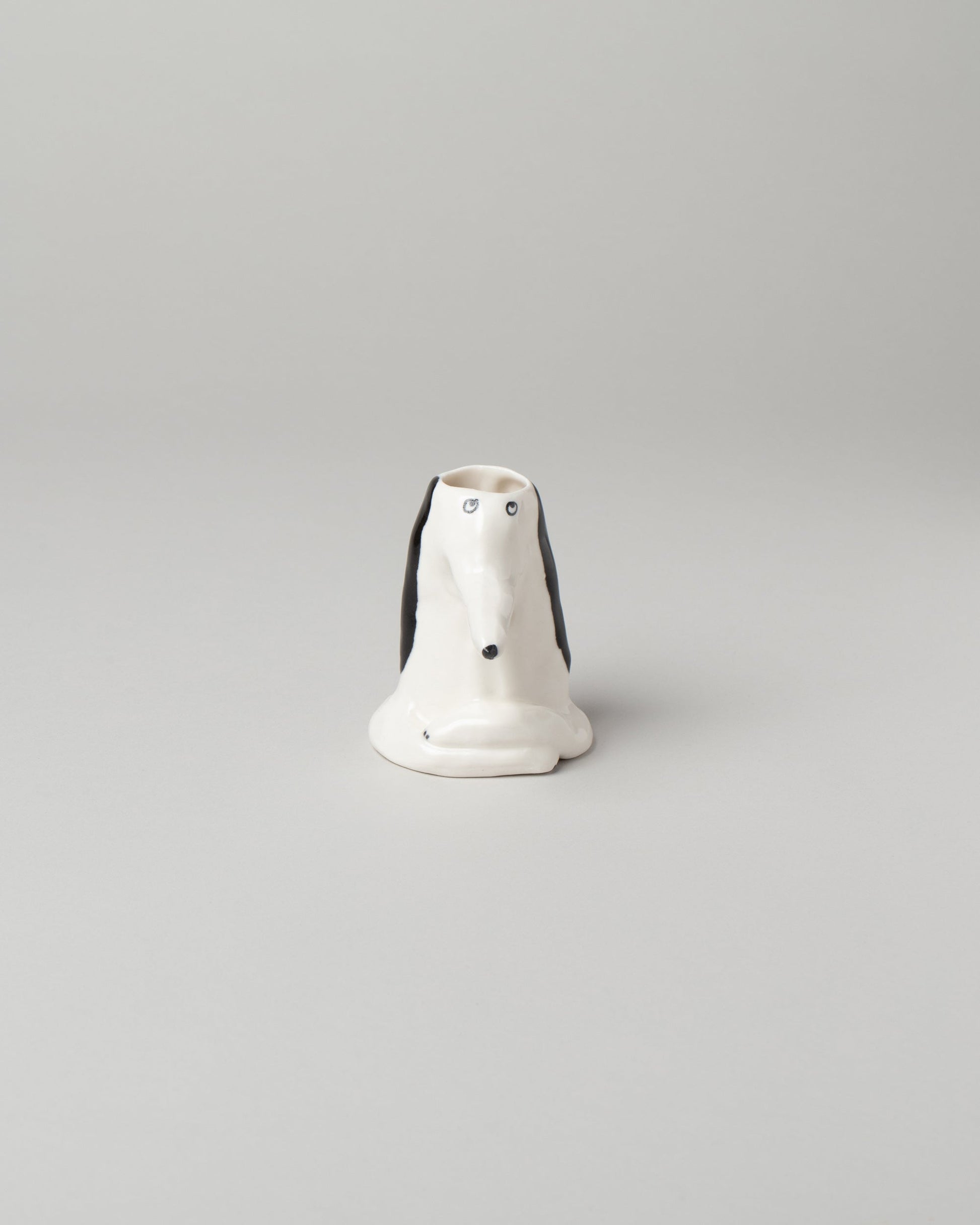 Eleonor Boström Dog Head Vase on light color background.