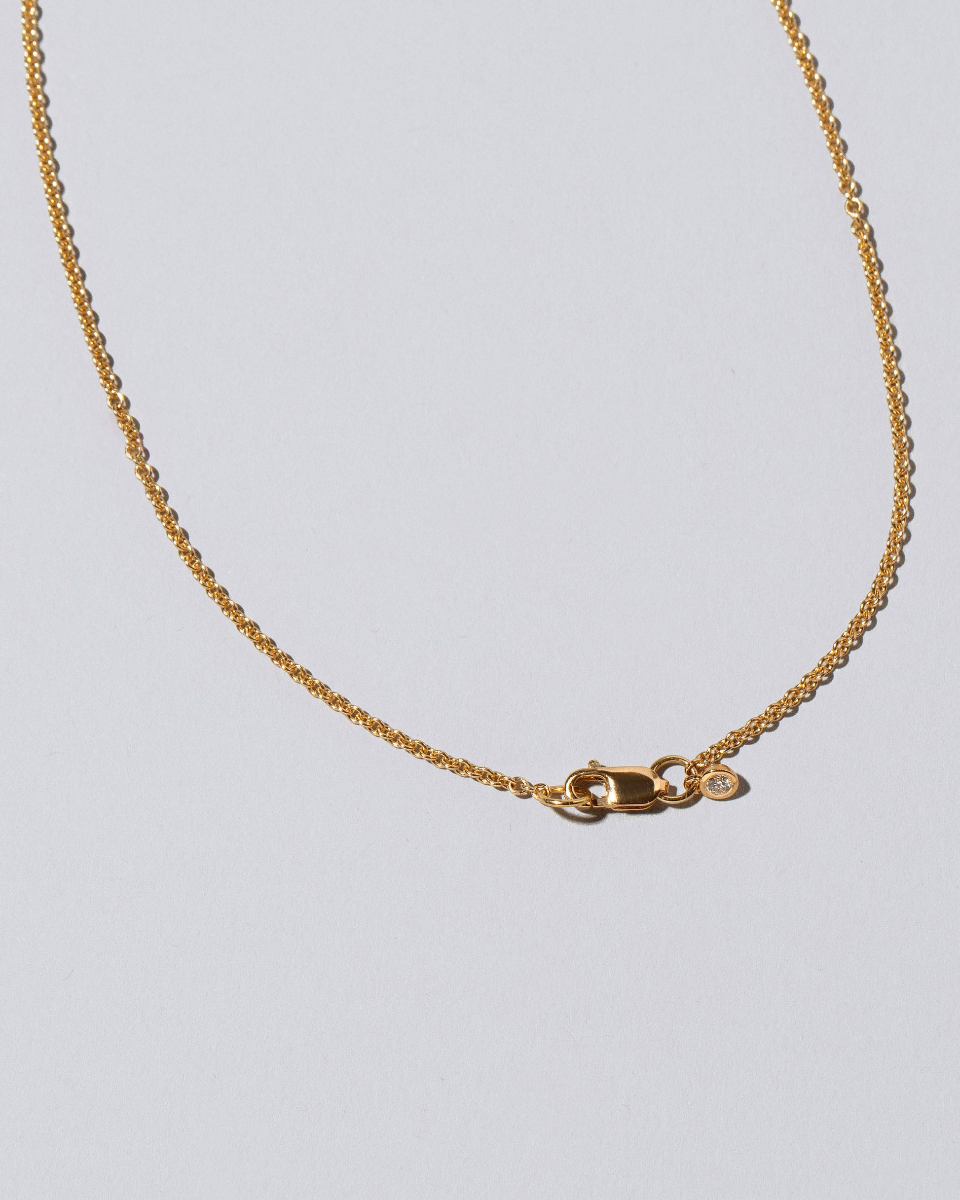 View from the back of the Amplify Necklace on light color background.