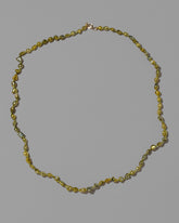 Ceto Necklace on light color background.
