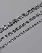 Closeup details of the CRZM Sterling Silver Bedrock Mini Bracelet, Sterling Silver Bedrock Medium Bracelet, and Sterling Silver Bedrock Bracelet on light color background.