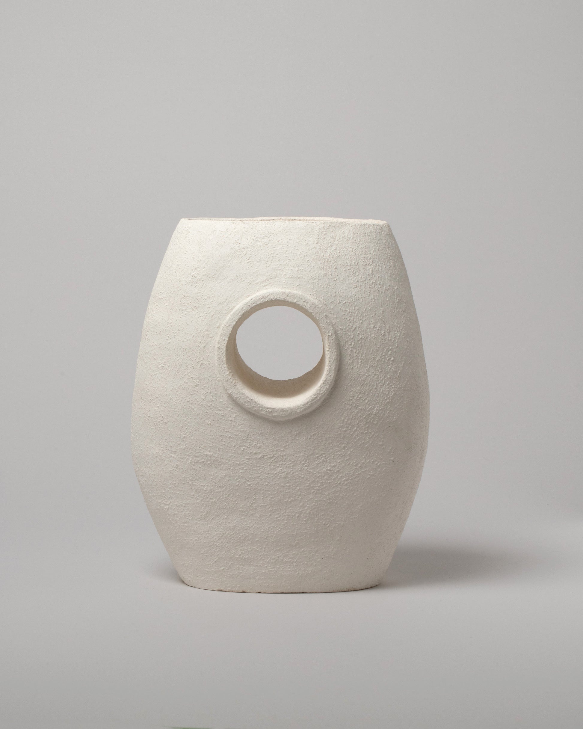 Stephanie Phillips Single Barrel Vessel on light color background.