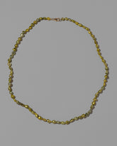 Oceanides Necklace on light color background.