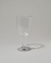 Silje Lindrup Twisted Wine Glass on light color background.