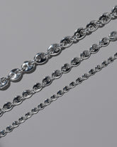 Closeup details of the CRZM Sterling Silver Bedrock Mini Bracelet, Sterling Silver Bedrock Medium Bracelet, and Sterling Silver Bedrock Bracelet on light color background.