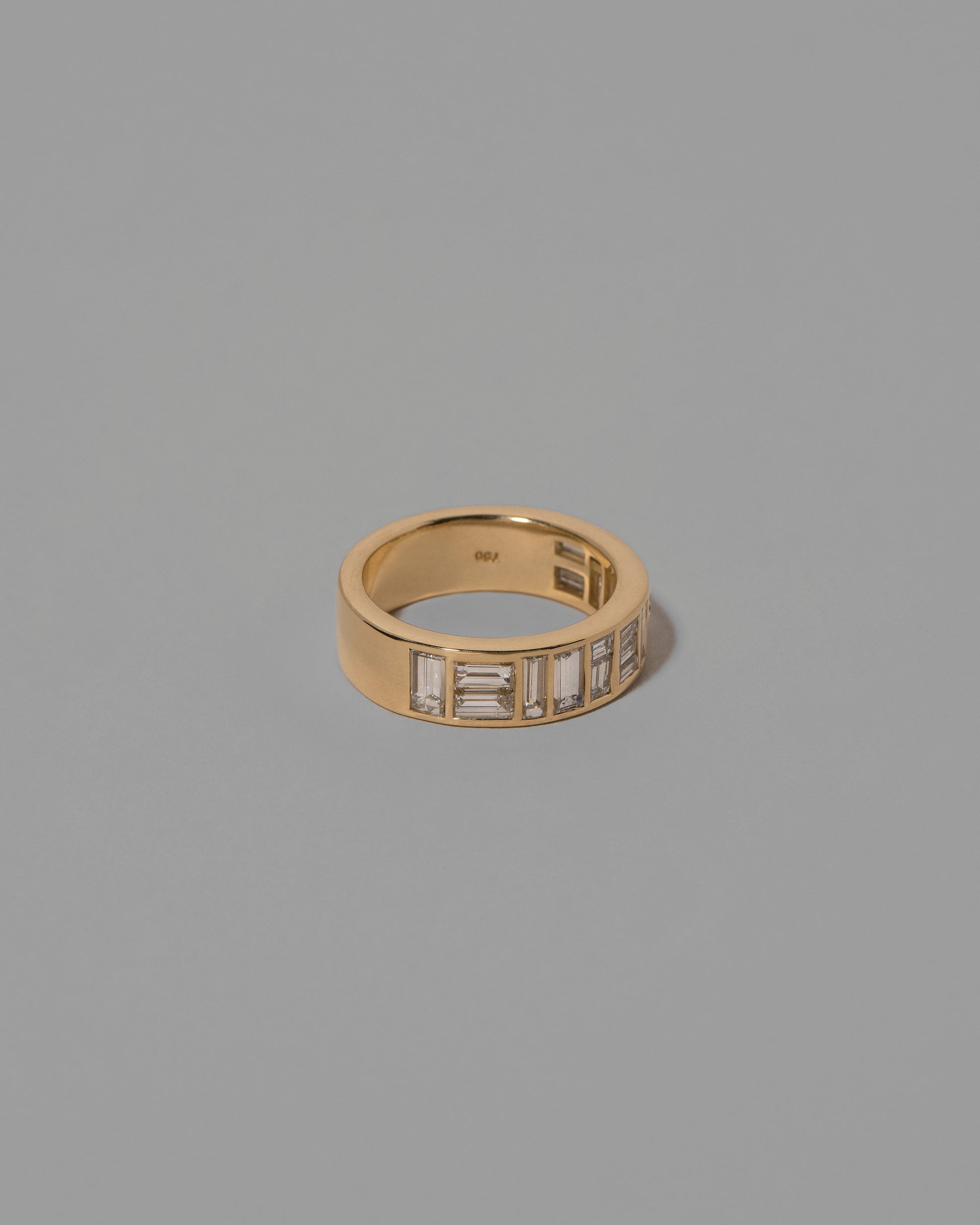 View from the side of the Mega Piet Ring on light color background.