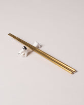 Eleonor Boström Black Chopstick Dog Rest on light color background.