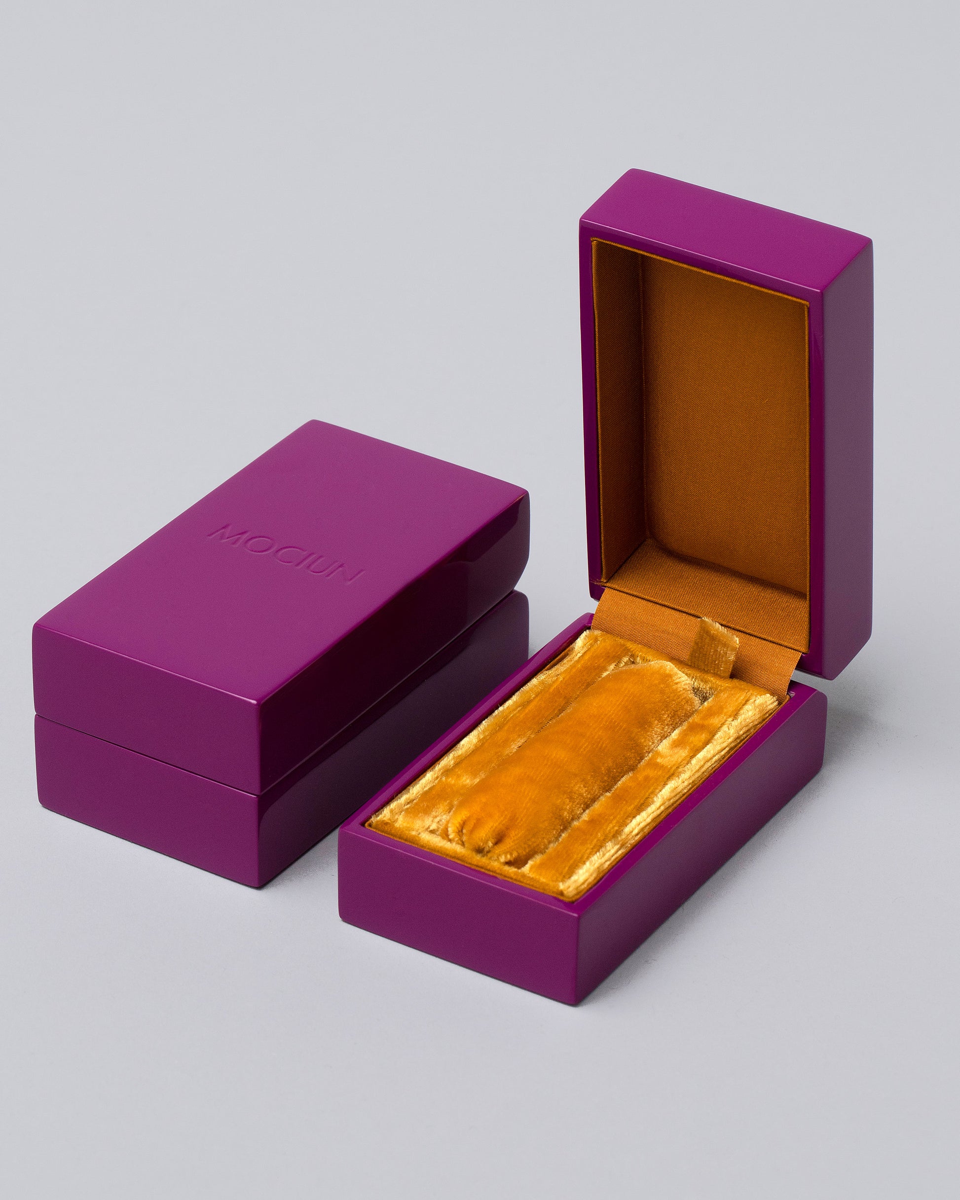 Rings & Bands Purple Lacquer Box on light color background.