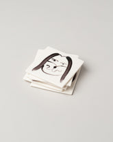 Eleonor Boström Dog Face Coasters on light color background.